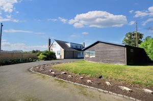 East entrance showing workshop/store- click for photo gallery